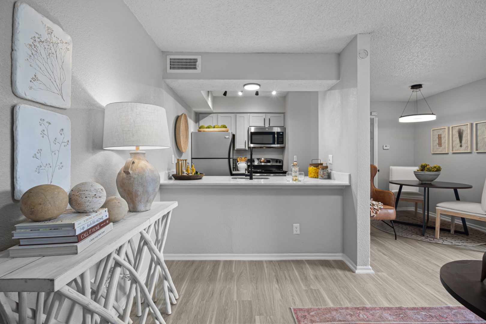 a black and white photo of a kitchen and dining area at The  Dahlia