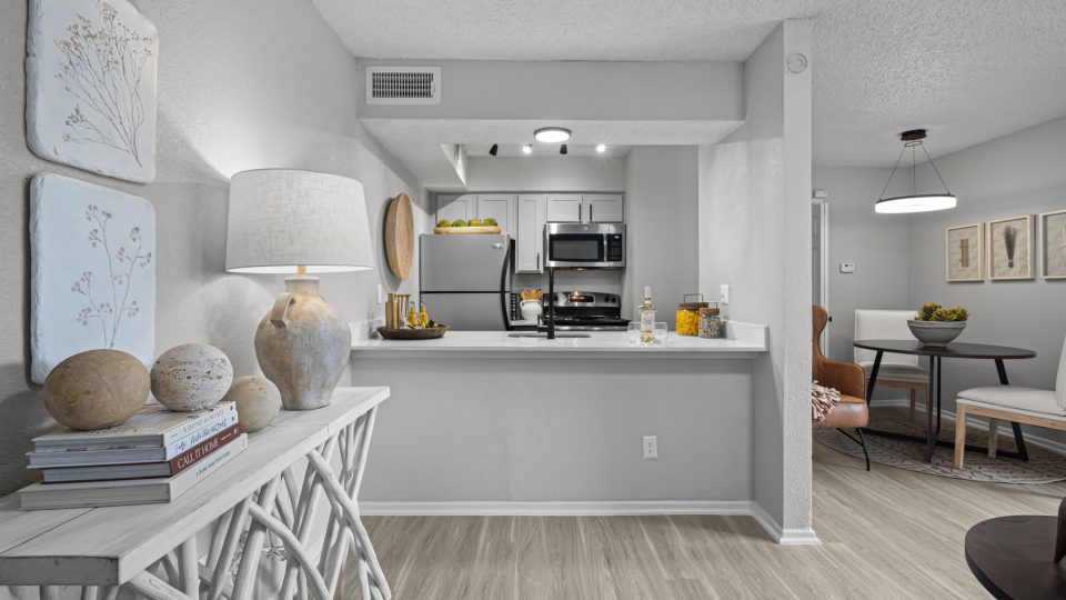 a black and white photo of a kitchen and dining area at The  Dahlia